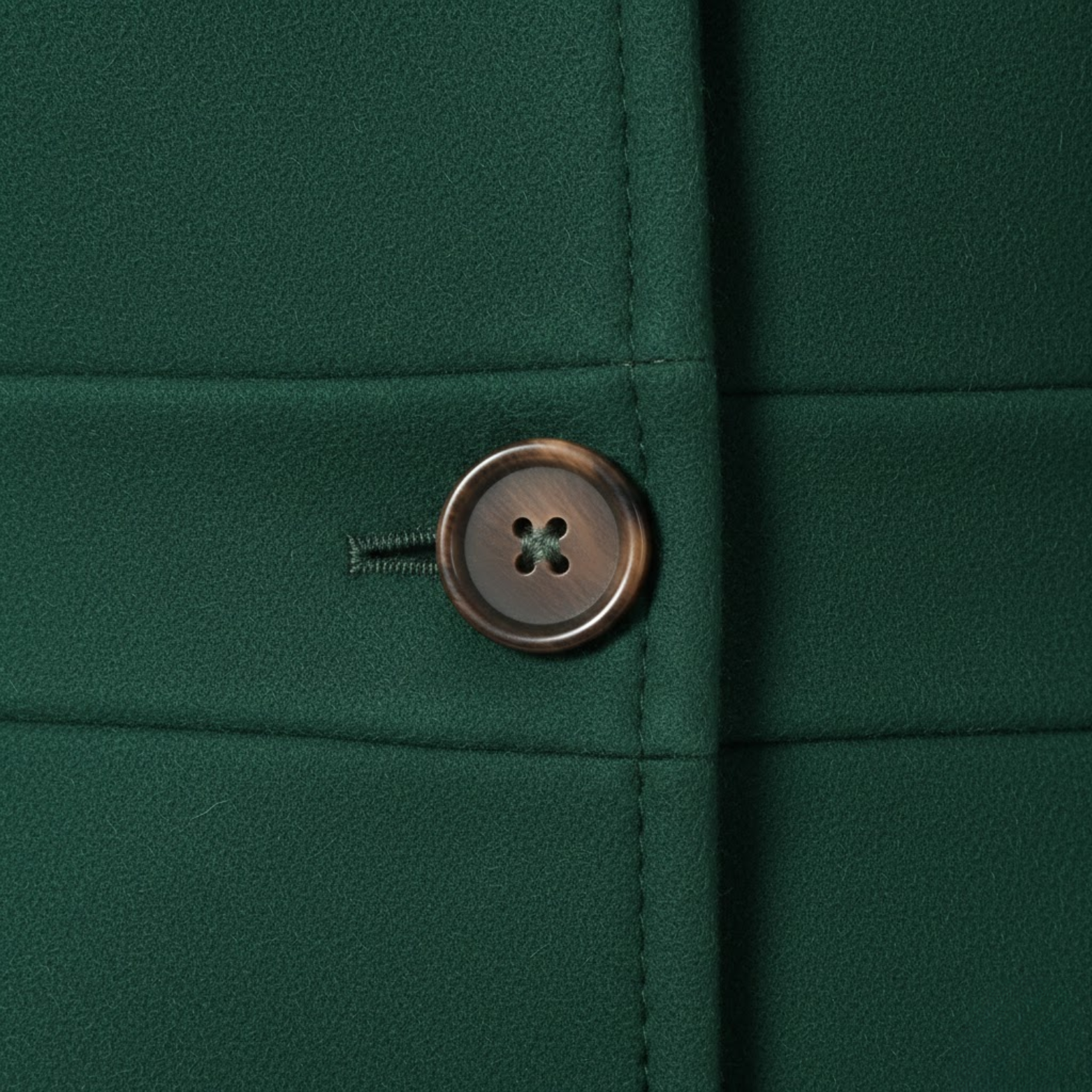 Mid-length wool coat with tailored collar and multiple buttons
